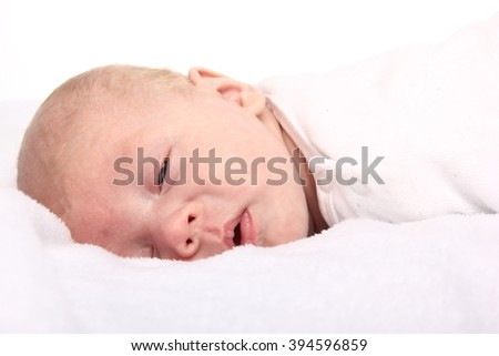 Similar – Newborn baby girl sleeping on blue sheets at home