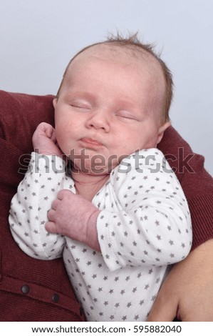 Similar – Image, Stock Photo Baby lies on a blanket and covers his eyes with his hands