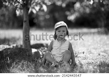 Similar – beautiful baby looking very funny into the the camera