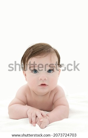 Similar – Baby girl four months old having her bath