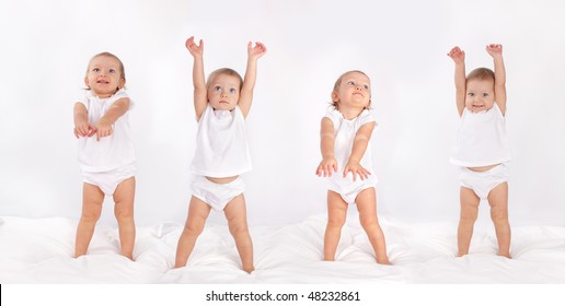 Beautiful baby dancing on bed