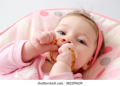 Beautiful Baby Girl Chewing Amber Teething Necklace