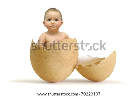 Beautiful baby inside an egg isolated in white