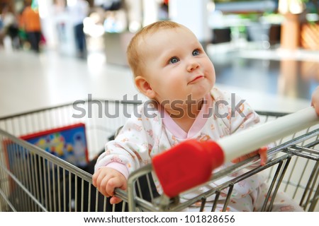 Beautiful baby in shopping cart - trolley