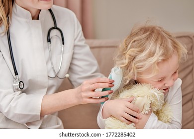 Beautiful Baby Turns His Head To The Side, Smiles Cute. Otoscope Hearing Test.