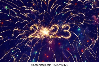 Beautiful background to New Year 2023  Sparkling burning creative numeral 2023 with star on blue Festive background of fireworks. - Shutterstock ID 2220943471