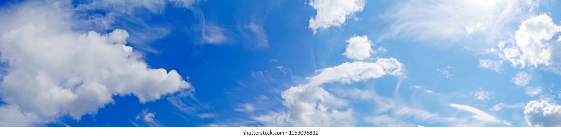 a beautiful background panorama with blue transparent sky air and white fluffy clouds fair weather cumulus humilis on a sunny day