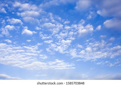 Beautiful background of white light clouds on a blue sky on a clear day