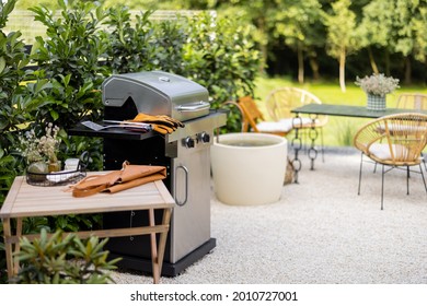 Beautiful Backyard With Barbeque Area And Dining Table