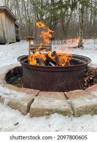A Beautiful Backyard Burning Camp Fire Set In The Snow. The Circular Stone Pit Creating A Ring Of Fire. Enjoy The Quiet Moments Sitting And Staring Into The Fire Reflecting-Every Minute Counts!
