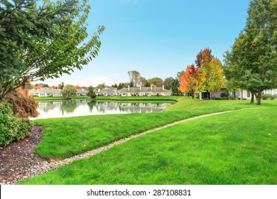 Beautiful Backyard With Water View And Lots Of Grass.