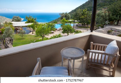 Beautiful Balcony, Terrace With Chairs And Table. Beautiful Sea And Mountain Landscape. Hotel Room And Resort View. ,