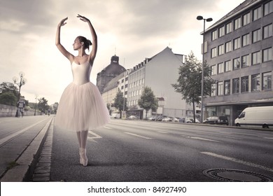 Beautiful ballerina dancing on a city street - Powered by Shutterstock