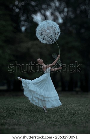 Beautiful ballerina with giant dandelions flowers