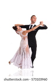 beautiful ballroom dance couple in a dance pose isolated on white background. sensual professional dancers dancing walz, tango, slowfox and quickstep