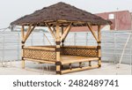 A beautiful bamboo gazebo with a thatched roof, perfect for relaxing and enjoying the outdoors. Gazebo in the rooftop house.jpg