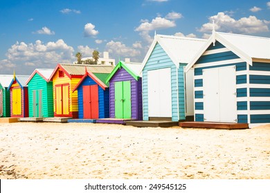 Beautiful Bathing houses on white sandy beach at Brighton in Melbourne, Australia.