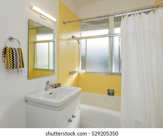 Beautiful Bathroom In White /yellow With Shower Curtain.