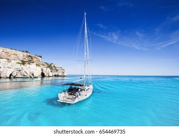 Beautiful Bay With Sailing Boats Yacht, Menorca Island, Spain. Yachting, Travel And Active Lifestyle Concept