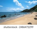 Beautiful bay in a sunny day with beautiful beach and rocks on the shore, in Jinshan, New Taipei City, Taiwan.