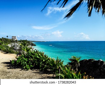 beautiful beach in caribe mexico in a sunny day with green and blue water