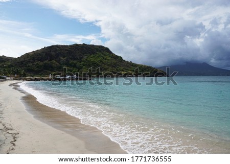 Beautiful beach at Cockleshell Bay, St. Kitts. The island of Nevis can be seen in the far right hand corner.