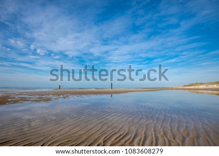 Beautiful Beach Of Domburg With Waterreflections And Wooden Pillars - Zeeland