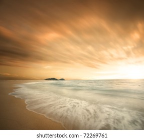 Beautiful Beach During Sunset With Fast Moving Clouds