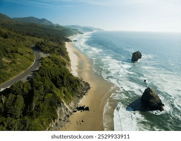 A beautiful beach with a rocky shoreline and a mountain range in the background. The ocean is calm and the sky is clear - Powered by Shutterstock