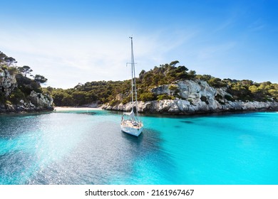 Beautiful beach with sailing boat yacht, Spain - Powered by Shutterstock