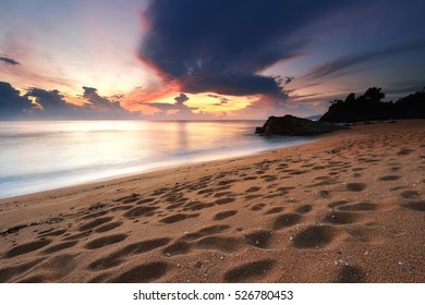 Beautiful beach at sunset with dramatic sky background. Natural composition.