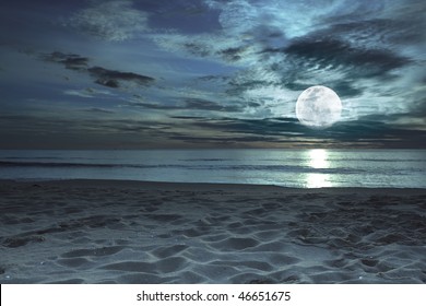 Beautiful Beach At Twilight Time With Moon In The Sky