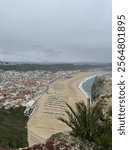 Beautiful beach view from highpoint, red portuguese architecture and ocean