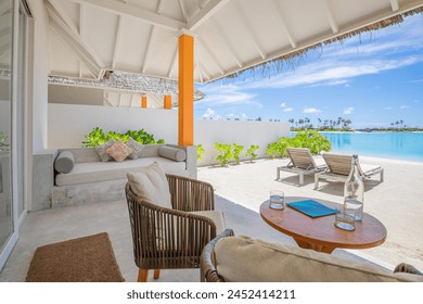 Beautiful beachfront and blue sky beach. Luxury tropical landscape from private villa with deck chairs table loungers and sea water. Summer travel vacation landscape. Carefree tourism home office view - Powered by Shutterstock