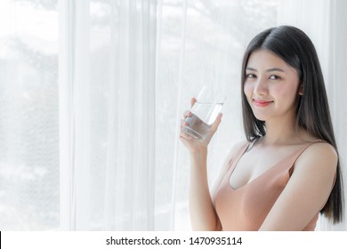 Beautiful Beauty Woman Asian Cute Girl Feel Happy Drinking Clean Drink Water For Good Health In The Morning , Enjoying Time In Her Home  White Bedroom Background - Lifestyle Beauty Woman Concept