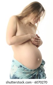 Beautiful Belly In Skirt From Pale Blue Shawl  Stand Sideview To A   Viewer. She Look On Her Belly And Thinking About Baby.