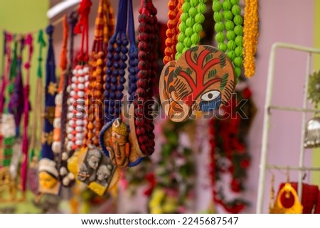 Beautiful Bengali traditional jewelery, works of handicraft, for sale during Handicraft Fair in Kolkata. Selective focus.