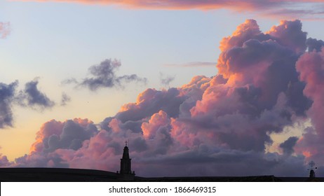 Beautiful Big Cloud At Dusk, Golden Hour With Blue Sky And Purple And Gold Clouds