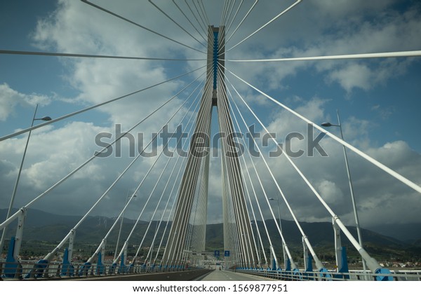 Beautiful, big, white bridge in greece. Photos made\
from a car.