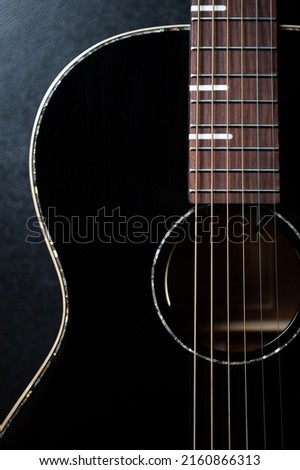 Beautiful black acoustic guitar. Curated collection of royalty free photos with professional musical instruments on shutterstock. Stock image of classic six string chordophone instrument for guitarist