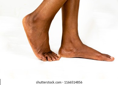 Beautiful Black female Flat feet with smooth skin. African American woman healthy foot baby. Feet of baby's naked isolated on white background for Skincare treatment and health concept