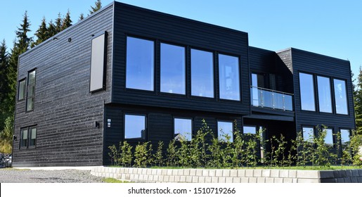 Beautiful Black Luxury Modern And Expensive Residence House Home Exterior And Facade With Green Garden In Sunny And Autumn Season - Norway/Norwegian