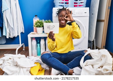 Beautiful Black Woman Doing Laundry Asking For Help Smiling Happy Doing Ok Sign With Hand On Eye Looking Through Fingers 