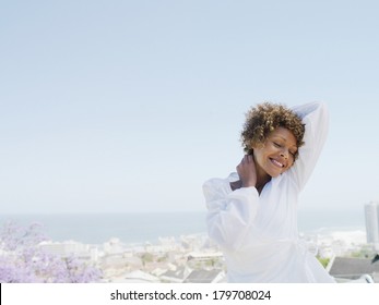 Beautiful Black Woman Dressing White At Morning Against Clear Blue Sky