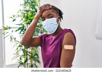 Beautiful Black Woman Getting Vaccine Showing Arm With Band Aid Stressed And Frustrated With Hand On Head, Surprised And Angry Face 