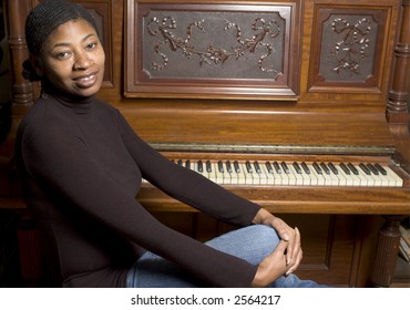 Beautiful Black Woman With Old Grand Upright Piano