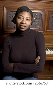 Beautiful Black Woman With Old Grand Upright Piano