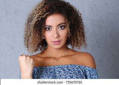 Beautiful Black Woman Portrait. Fists His Fist Browsing