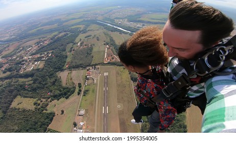 Beautiful Black Woman Practicing Skydiving. Tandem Jump With Selfie Image.