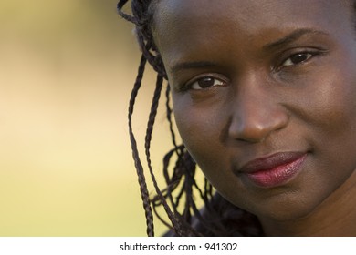 A Beautiful Black Woman Shot In Close Up With A Wistful Smile